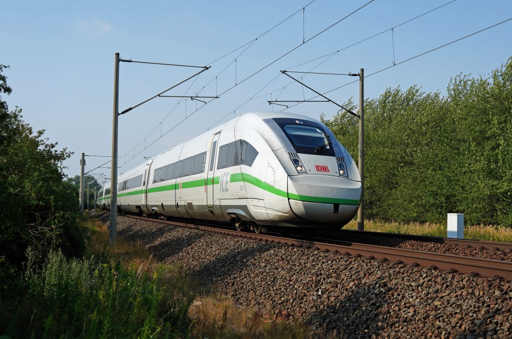 DB long-distance traffic with ICE 4 class 412 in "That's green" design on the road at Rackwitz