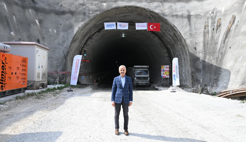 Turkish transport minister posing at a tunnel for the high-speed railway line